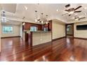 A spacious open-concept living area boasts hardwood floors, recessed lighting, and a breakfast bar at 4914 Gran Lac Ave, Belle Isle, FL 32812