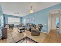 Living Room with gray sectional sofa and light blue walls at 588 Brantley Terrace Way # 303, Altamonte Springs, FL 32714