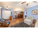 Charming dining room with hardwood floors and elegant light fixture at 8773 Silk Bay Pl, Orlando, FL 32827