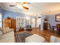 Spacious living room featuring hardwood floors and comfy furniture at 8773 Silk Bay Pl, Orlando, FL 32827