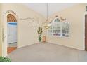 Bright dining room with decorative wall art and large window at 926 Palm Oak Dr, Apopka, FL 32712