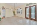 Bright dining room with decorative wall art and large window at 926 Palm Oak Dr, Apopka, FL 32712
