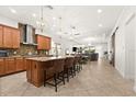 Spacious kitchen with granite countertops, a large island with seating, and stainless steel appliances at 10824 Royal Cypress Way, Orlando, FL 32836