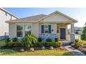 One-story house featuring a charming front porch and nicely landscaped yard at 16626 Point Rock Dr, Winter Garden, FL 34787