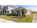 Craftsman style home with a welcoming front porch and nicely manicured lawn at 16626 Point Rock Dr, Winter Garden, FL 34787