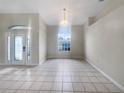 Bright dining room with tile floors and a chandelier at 1878 Algonquin Ave, Deltona, FL 32725
