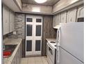 Updated kitchen with granite countertops and wood cabinets at 1902 Honour Rd # 9, Orlando, FL 32839