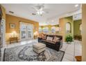 Open living space with a comfortable couch and access to a back patio at 412 Vista Dr, Davenport, FL 33897