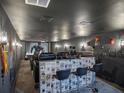 State-of-the-art home theater with a bar and superhero decor at 4510 Packard S Ave, St Cloud, FL 34772