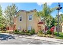 Two-story townhome features appealing facade and landscaping at 4732 Vero Beach Pl, Kissimmee, FL 34746