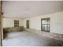 A well-lit porch area with classic brick detailing, enhanced by multiple windows and offering lots of natural light at 585 Gasline Rd, Deland, FL 32724