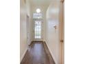 Bright entryway with hardwood floors and doors leading to other rooms at 654 Harbor Villa Ct, Clermont, FL 34711