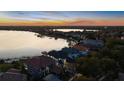 Luxury waterfront home with stunning sunset views and private dock at 8010 Firenze Blvd, Orlando, FL 32836
