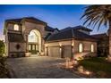 Elegant two-story home with a three-car garage and manicured landscaping at 8010 Firenze Blvd, Orlando, FL 32836