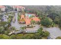 Aerial view showing resort-style pool and community clubhouse at 8010 Tuscany Way # 5302, Davenport, FL 33896