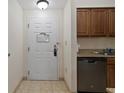 Condo entryway with door and kitchen view at 12527 Floridays Resort Dr # E102, Orlando, FL 32821