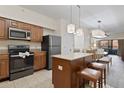 Modern kitchen with island and stainless appliances at 12527 Floridays Resort Dr # E102, Orlando, FL 32821