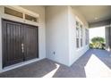 Front entrance with double doors and a brick walkway at 13370 Alderley Dr, Orlando, FL 32832