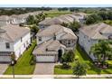 Two-story house in a neighborhood, near a golf course at 1555 Palmero Way, Davenport, FL 33896