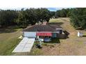 House with detached garage and expansive lot at 17211 Se 160Th Avenue Rd, Weirsdale, FL 32195
