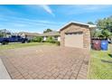 Single Gathering home with attached garage and paver driveway at 1748 Christina Lee Lane, St Cloud, FL 34769