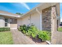 Neat walkway leading to the front entrance of the home at 1748 Christina Lee Lane, St Cloud, FL 34769