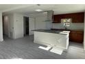 Modern kitchen with granite countertops and stainless steel appliances at 1821 Rogers Ave, Maitland, FL 32751