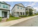 Two-story house on a tree-lined street with landscaping and sidewalk at 1997 Standing Rock Cir, Oakland, FL 34787