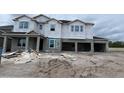 New construction home featuring an attached two car garage in a residential neighborhood at 2726 Ravencliffe Ter, Oviedo, FL 32765