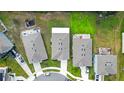 Several houses with backyards, showing rooflines and lot sizes at 3627 Crimson Clover Dr, Mount Dora, FL 32757