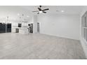 Modern kitchen featuring white cabinets, stainless steel appliances, and a large island at 6455 Hemlock Rd, Ocala, FL 34472