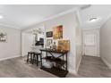 Open concept living space with kitchen view and hardwood floors at 8465 Oak Bluff Dr, Orlando, FL 32827
