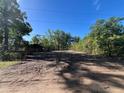 Spacious, cleared lot awaiting construction with lush, mature trees in a desirable location at 25122 Ensley Rd, Sorrento, FL 32776