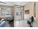 Bright entryway with glass doors, tile floors, and decorative accents at 33931 Terragona Dr, Sorrento, FL 32776
