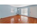 Bright living room with hardwood floors and light blue walls at 514 S Crystal Lake Dr, Orlando, FL 32803