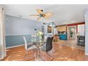 Sunlit dining area with contemporary furnishings, seamlessly connecting to the kitchen and living spaces, perfect for modern living at 5607 Huber Dr, Orlando, FL 32818