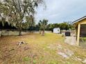 Spacious backyard with a shed and partially visible fence at 567 Rachael Court, Oviedo, FL 32765