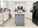 Spacious kitchen with island and stainless steel appliances at 5861 Windridge Dr, Winter Haven, FL 33881