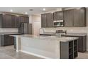 Modern kitchen with granite countertops and stainless steel appliances at Tbd Ensley Rd, Sorrento, FL 32776