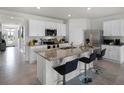 Spacious kitchen with island, stainless steel appliances, and granite countertops at 1328 Hanoverian Dr, Lake Alfred, FL 33850