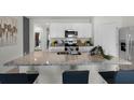 Kitchen island with granite countertop and seating for four at 1328 Hanoverian Dr, Lake Alfred, FL 33850