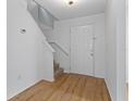 Bright entryway with light wood floors and staircase at 1606 Sandy Point Sq # 53, Orlando, FL 32807