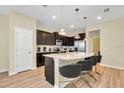 Modern kitchen with granite countertops and stainless steel appliances at 1721 Kona Ln, Davenport, FL 33897