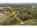 House and large lot surrounded by lush trees at 19106 Sheldon St, Orlando, FL 32833