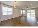 Spacious living room featuring hardwood floors and sliding glass doors at 2232 Donahue Dr, Ocoee, FL 34761