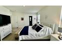 Bright bedroom with a comfortable bed and plenty of closet space at 3033 Timber Hawk Cir, Ocoee, FL 34761