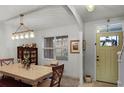 Bright dining room featuring a table, chairs, and a display cabinet at 351 Lazio Cir, Debary, FL 32713