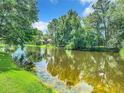 Serene view of a tranquil lake with lush greenery at 5020 Shoreline Cir, Sanford, FL 32771