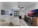 Spacious living room with sectional sofa, large TV, and aquarium at 711 Centervale Dr # 711, Celebration, FL 34747