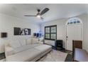 Spacious living room with sectional sofa, large TV, and aquarium at 711 Centervale Dr # 711, Celebration, FL 34747